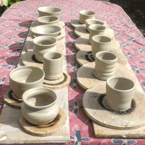 rows of pots made on the potters wheel by first time potters in Northern Ireland